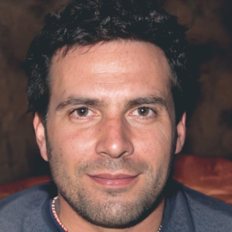 Professional headshot of male team member